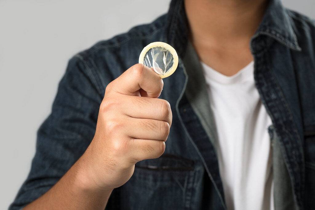 man-holding-the-condom