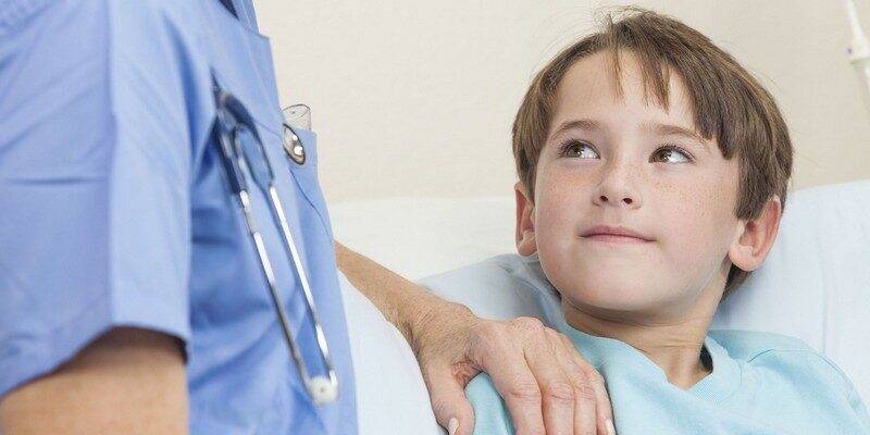 doctor-or-nurse-comforting-young-boy-child-patient