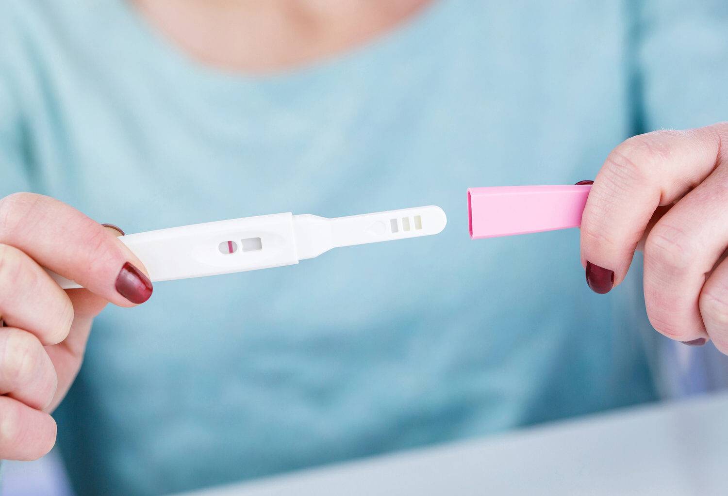 young-woman-holding-a-pregnancy-test-in-her-hands