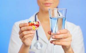 pills-tablets-and-drugs-heap-in-doctor-hand-closeup-view