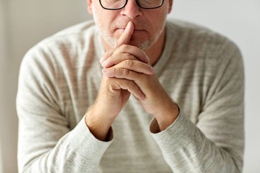 close-up-of-senior-man-in-glasses-thinking